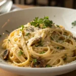 Truffle Pasta Recipe served in a white bowl with creamy sauce, Parmesan, and parsley.