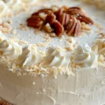 Italian Cream Cake with cream cheese frosting, toasted pecans, and coconut – a moist, flavorful Southern dessert.